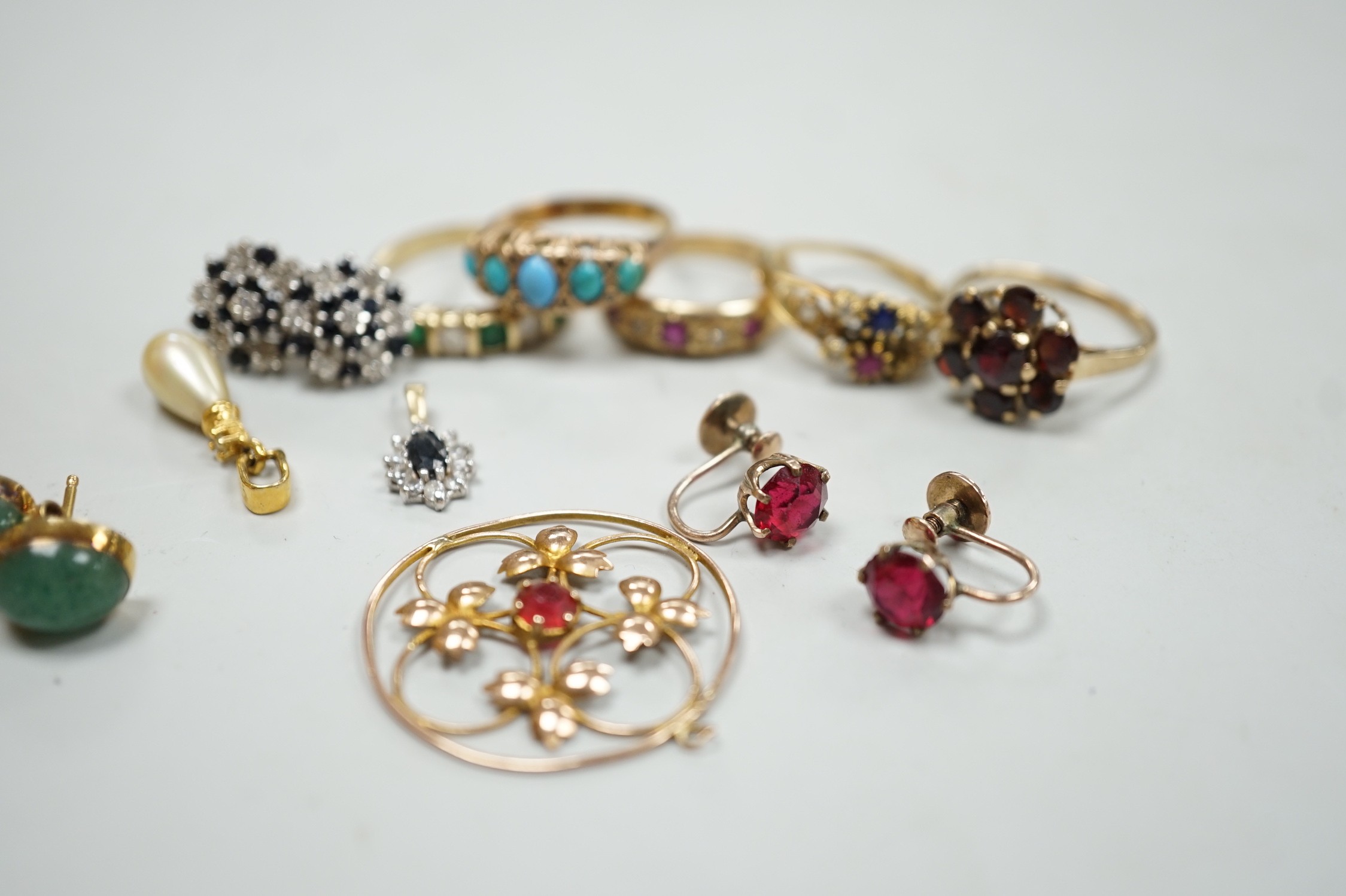 Five assorted 9k and gem set rings including ruby and diamond gypsy set and other jewellery.